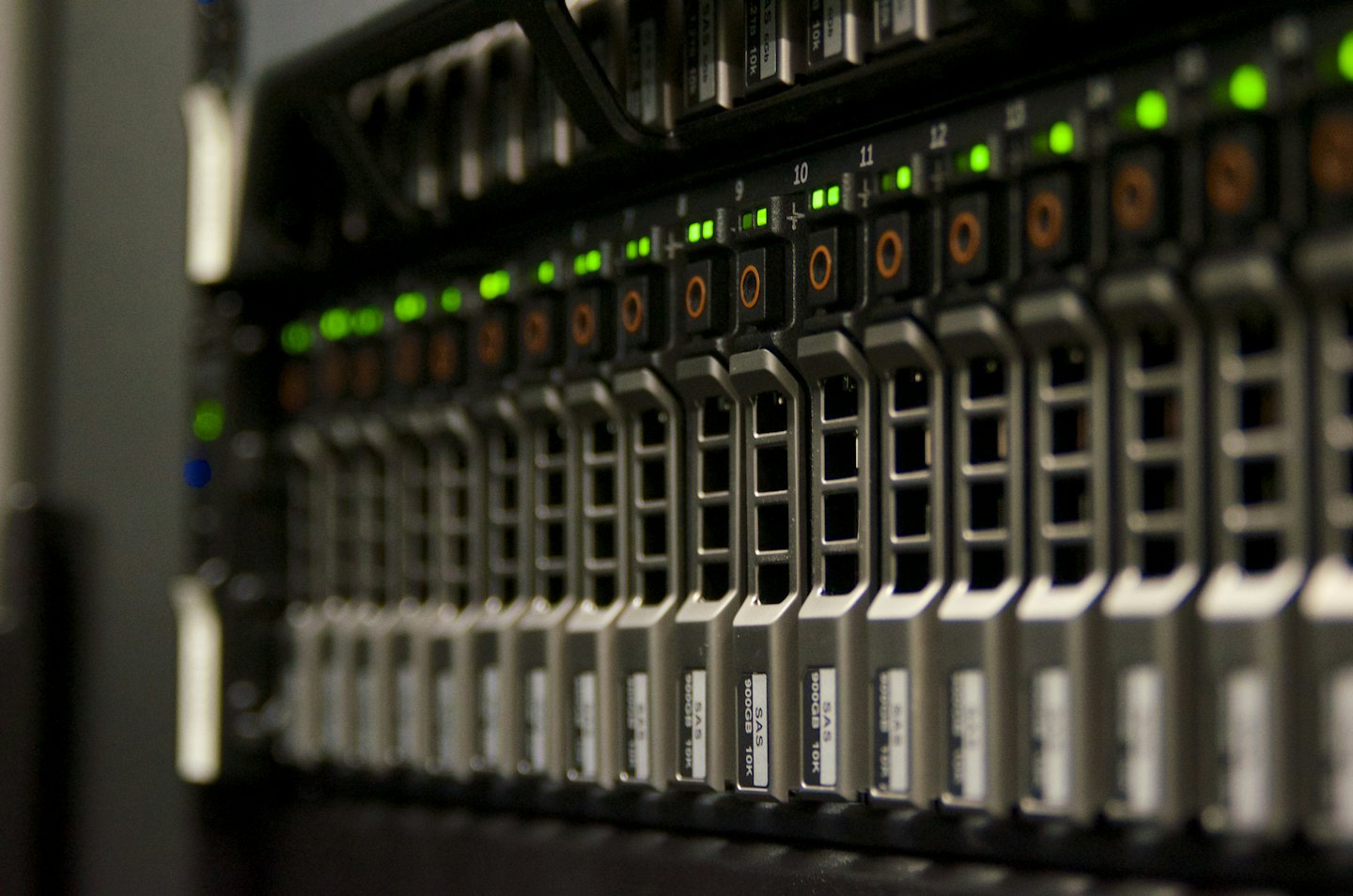 Server rack with glowing green indicator lights.